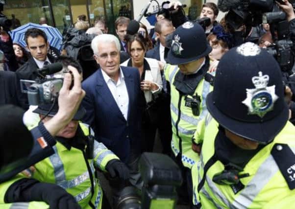 PR guru Max Clifford leaves Westminster Magistrates' Court in London
