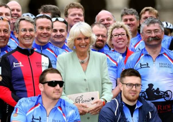 The Duchess of Cornwall with riders taking part in the  Help for Heroes Big Battlefield, Paris to London Bike Ride at Les Invalides, in  Paris