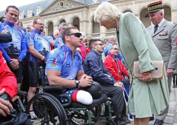 The Duchess of Cornwall speaks with riders taking part in the  Help for Heroes Big Battlefield, Paris to London Bike Ride at Les Invalides, in  Paris