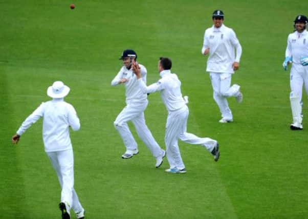 England's Graeme Swann (centre) and Ian Bell (second left) who caught out New Zealand's Doug Bracewell celebrate taking his wicket during the Second Investec Test match at Headingley, Leeds. (Picture: Owen Humphreys/PA Wire).
