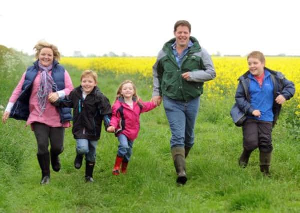 Farmer Mike Wilkinson with his wife Lorna and children  Ben, Katie and Toby