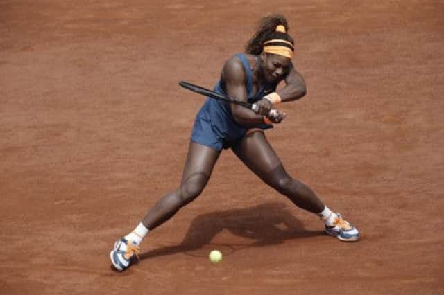 Serena Williams returns against Italy's Roberta Vinci