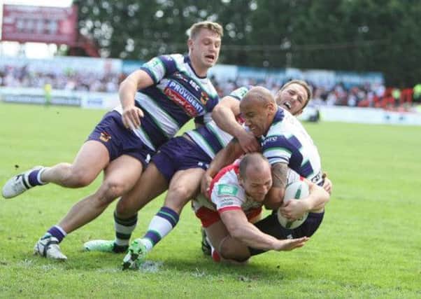 Rhys Lovegrove going over to score the first Hull KR try