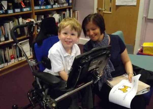 Callum enjoying one if his sessions with speech and language therapist Kimberly Ward.