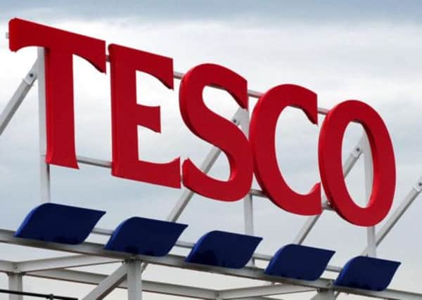 Tesco was left counting the cost of the horse meat scandal as it revealed falling UK sales