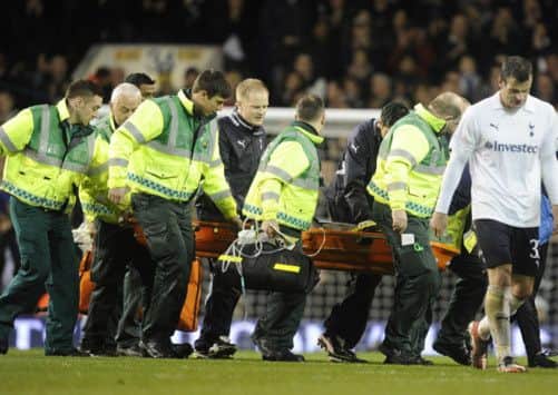 The medical team carries off Fabrice Muamba during an FA Cup match in 2012.