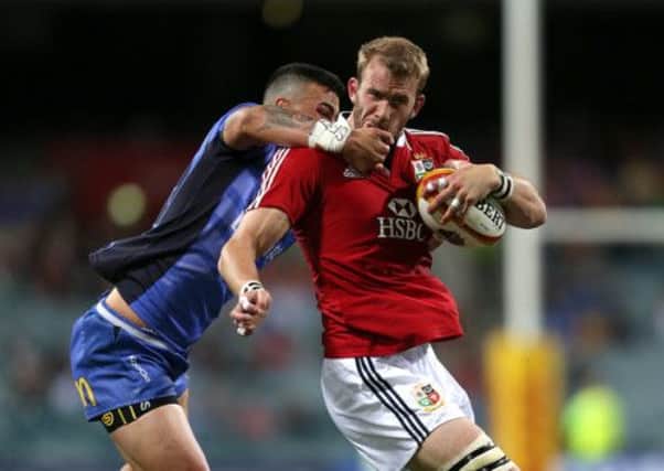 British and Irish Lions' Tom Croft (right) is tackled by Western Force's Chris Tuatara-Morrison