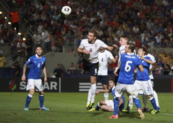 England's Craig Dawson scores a goal that was ruled out by Italy's Luca Caldirola