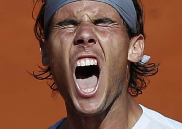 Spain's Rafael Nadal reacts as he plays Serbia's Novak Djokovic during their semifinal match of the French Open