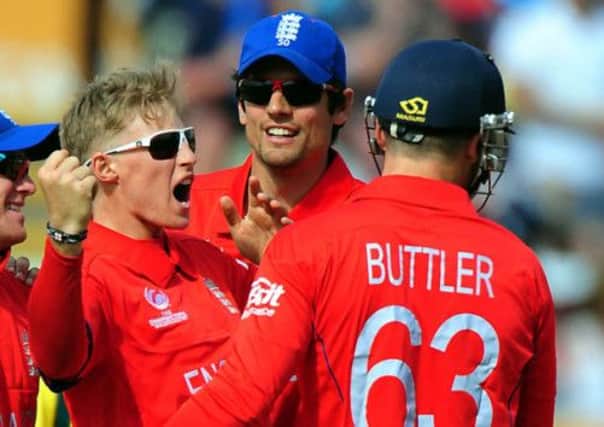 England's Joe Root celebrates after Australia's Phil Hughes is given LBW