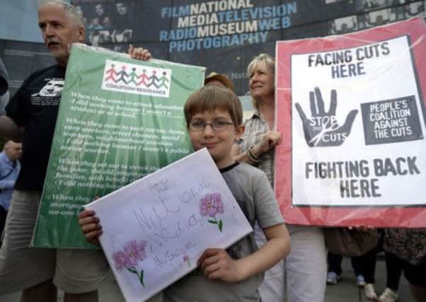 Six year-old Sam Rainbow of Bradford takes part in a demonstaration to keep open the National Media Museum