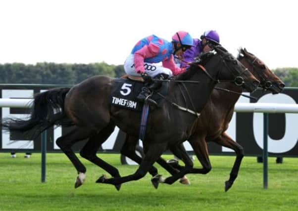Amarillo ridden by Andrasch Starke (right) beats Pastoral Player ridden by Graham Lee (number 5) to win the Timeform Jury Stakes