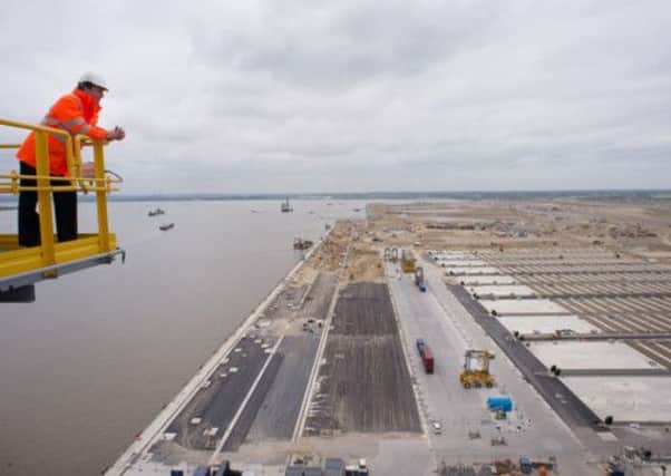 David Cameron looks over the Thames estuary from the top of a 138m high quay crane at the new London Gateway container port