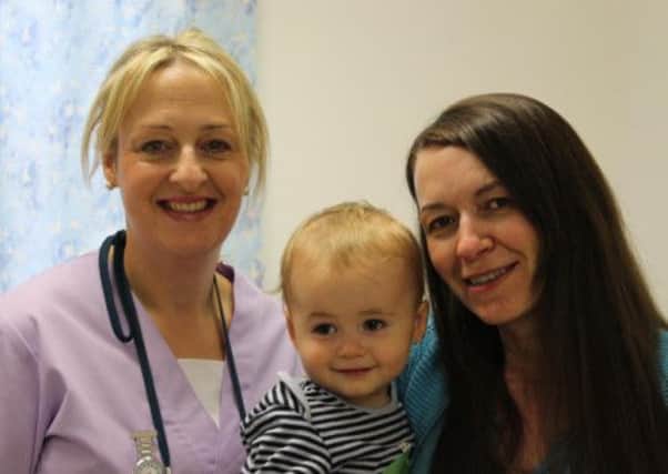 Claire Marron with son Alfie and community midwife Sue Symonds