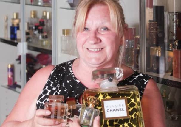 Gail Cherowbrier of Doncaster who collects perfume bottles at puts them on display in her home.