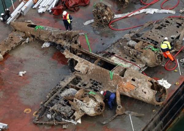 The remains of a crashed World War II Dornier bomber, the only surviving German Second World War Dornier Do 17 bomber, lays on a barge near Deal in the English Channel.