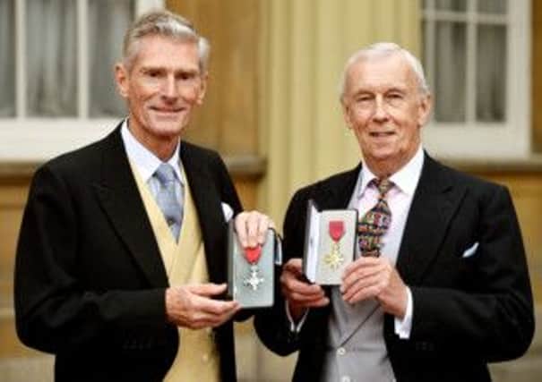 Norman Gundill (left) proudly holds his MBE, with John Sanderson holding his OBE