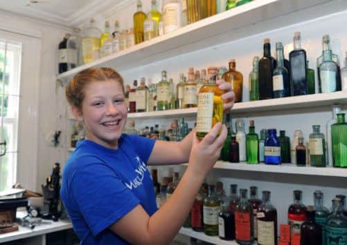 Rose Wright, 15, from Illinios, in the dispensing room at  The World of James Herriot in Thirsk