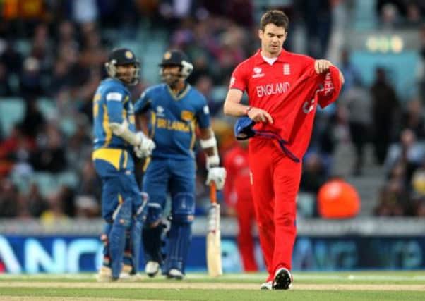 England's James Anderson walks dejected during the ICC Champions Trophy match at The Kia Oval