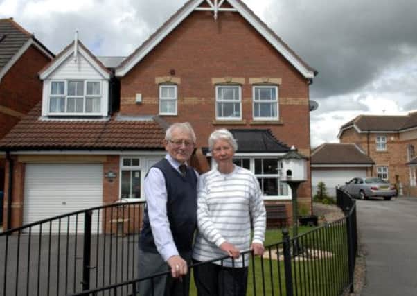 Barry and Kathleen Holmes outside their home in Weald Park, Kingswood, Hull which was flooded in 2007.