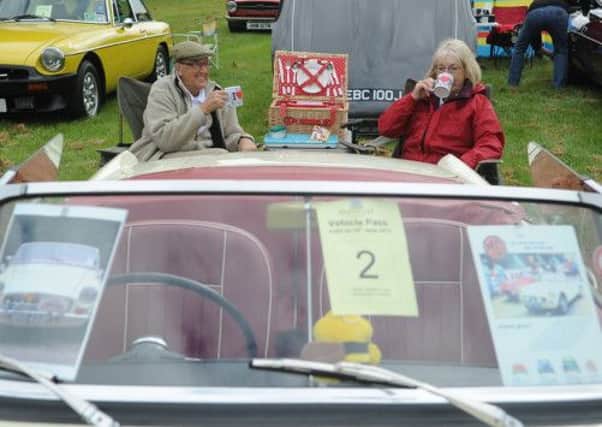 Les and Shirley Rodshaw from Glusburn near Skipton enjoy a brew by their 1967 MGB roadster. 
Pictuire by Gerard Binks
