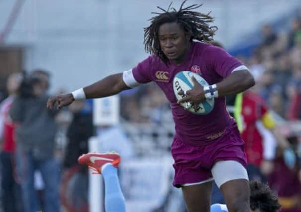England's Marlan Yarde is tackled by Argentina's Martin Bustos Moyano