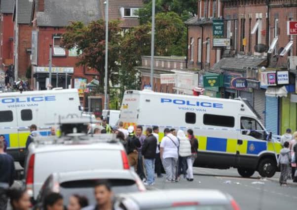 Poice block Harehills Lane in Leeds during a 'hostage situation' at a Sainsbury's store.  Picture: Bruce Rollinson