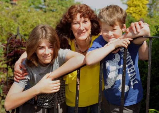 Christine Walker with her son Robert 14 (left) and grandson Scott 9 at her home at Summerbridge  near Pateley Bridge.