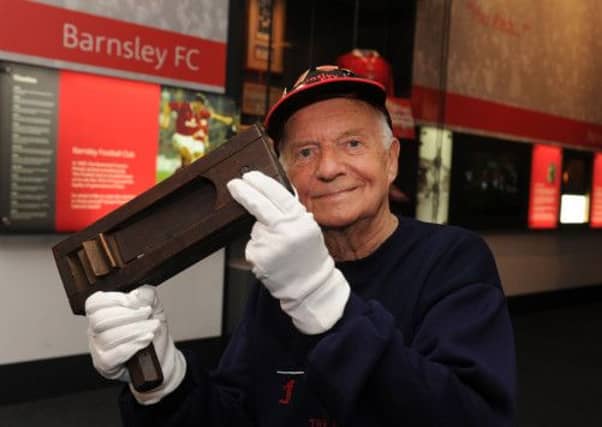 Arthur Bower, Barnsley FC historian, with the rattle he first took to a game in 1949