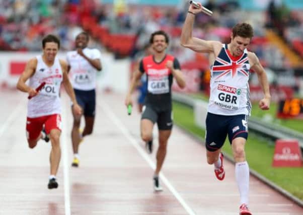 Great Britain's Richard Buck celebrates his team winning the men's 4x400metre relay