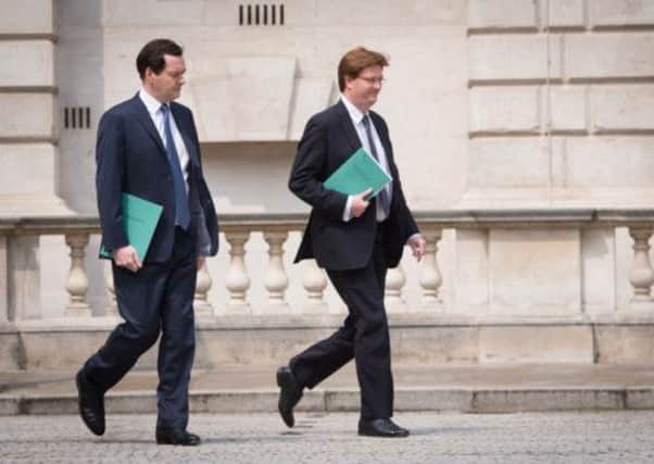 Chancellor George Osborne and Chief Secretary to the Treasury Danny Alexander leave the Treasury for the House of Commons