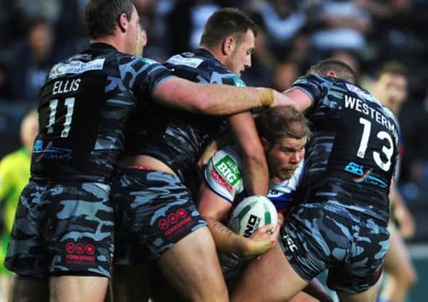 Wakefield Wildcats' Danny Washbrook looks to play the ball from a tight Hull FC defence