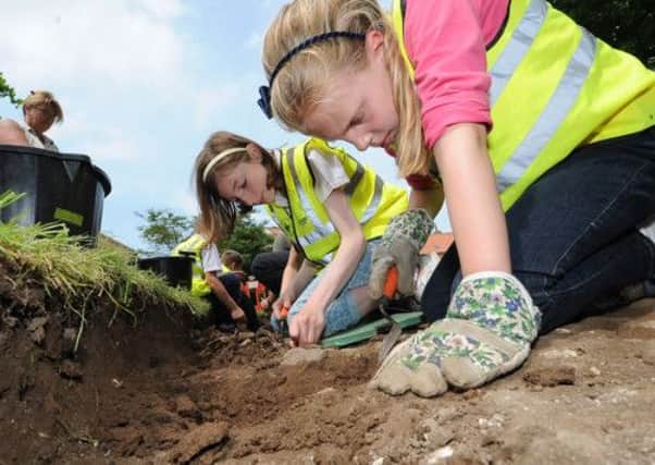 School children from Marton Cum Grafton CofE Primary School take part in archaeological dig on the site of the old school in Marton Cum Grafton