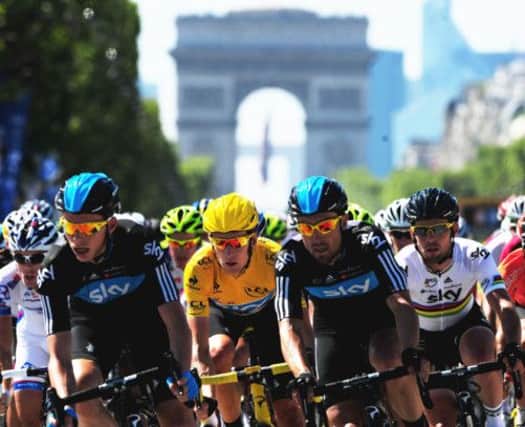 Great Britain's Bradley Wiggins of Sky Pro Racing (yellow jersey), rides with team mates Mark Cavendish (right), Chris Froome (left) and Bernhard Eisel (second left). Picture: PA Wire