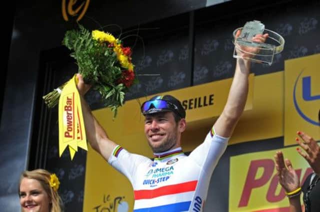 Mark Cavendish celebrates on the podium after winning Stage 5 of the 2013 Tour de France from Cagnes-sur-Mer to Marseille.  (Picture: Bruce Rollinson)