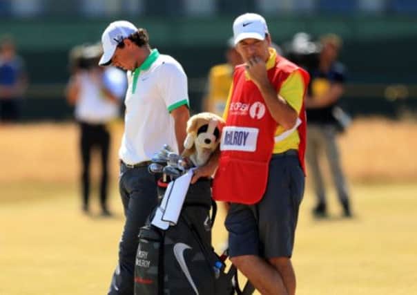 Northern Ireland's Rory McIlroy looks dejected with his caddy JP Fitzgerald