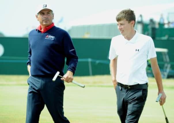 Matthew Fitzpatrick, right, walks off the 18th with USA's Fred Couples