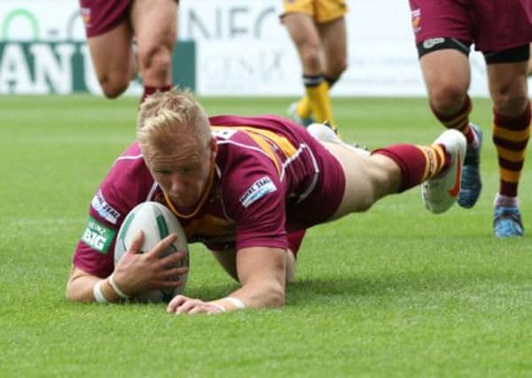 Huddersfield Giants' Aaron Murphy goes over for a try during the Super League match at the John Smith's Stadium, Huddersfield. (Picture: Lynne Cameron/PA Wire).