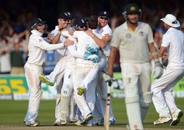 England's players celebrate the last wicket to win the second Test on day four of the Second Investec Ashes Test at Lord's