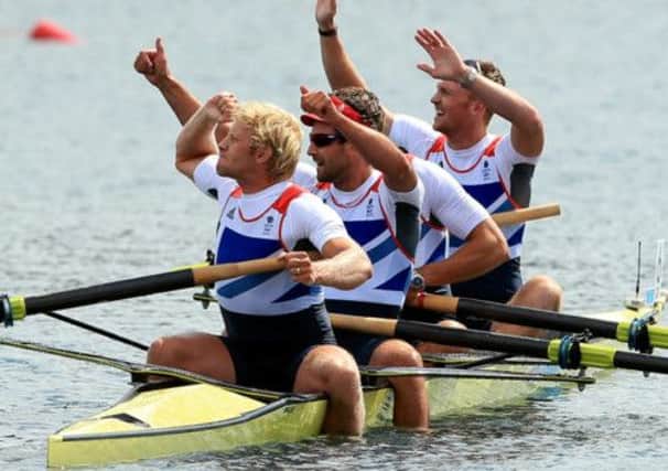 Great Britain's Men's Four of (left to right) Andrew Triggs Hodge, Tom James, Pete Reed and Alex Gregory celebrate winning gold