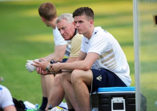 Sam Byram watches from the sidelines.