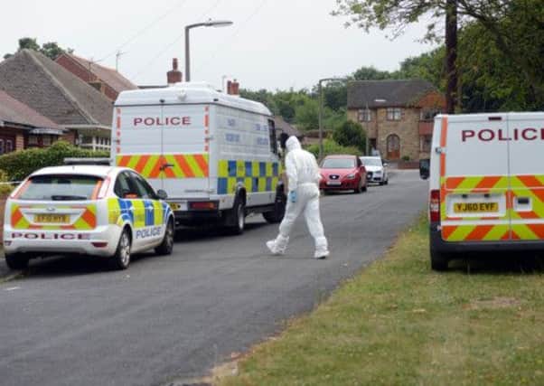 Police at the scene of a house on Sandygate, Wath upon Dearne, where the bodies of two women have been found
