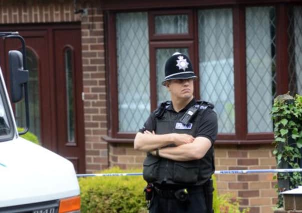 Police at the scene of a house in Wath upon Dearne where the bodies of two women have been found