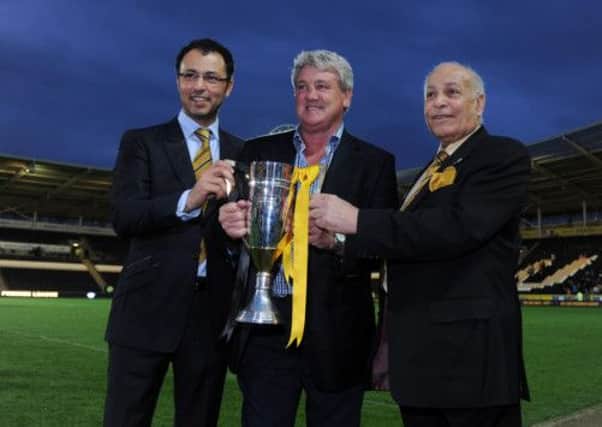 Hull City manager Steve Bruce, centre with owners Ehab Allam, left, and Dr Assem Allam