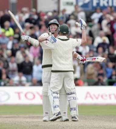 Australia's Brett Lee and Glenn McGrath celebrate after saving the third npower Test match against England during the final day at Old Trafford Cricket Ground, Manchester, in 2005. PRESS ASSOCIATION Photo. Picture: Martin Rickett/PA.