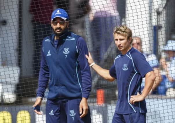 Nottinghamshire's James Taylor (right) and Sussex's Monty Panesar