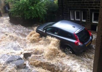 Water cascading down a street in Todmorden. Picture: James Stuttard