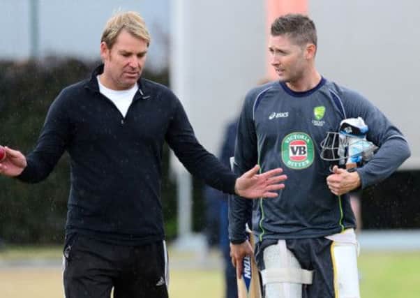 Australia captain Michael Clarke talks with Shane Warne during the nets session at Old Trafford