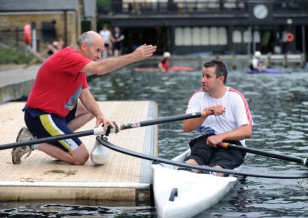 Yorkshire Post's Nick Westby, gets expert advice from Leeds Rowling Club's learn to row coach David Cottrell on Roundhay Park Lake. (Picture: Jonathan Gawthorpe).