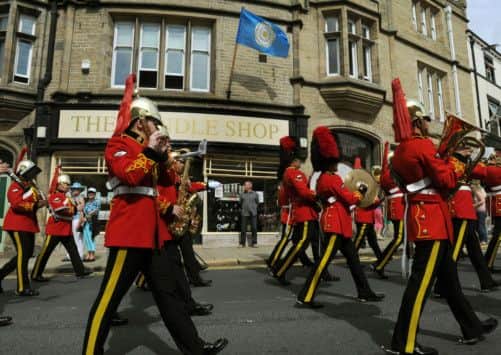 The Yorkshire Day parade moves up towrads  the high street in Skipton